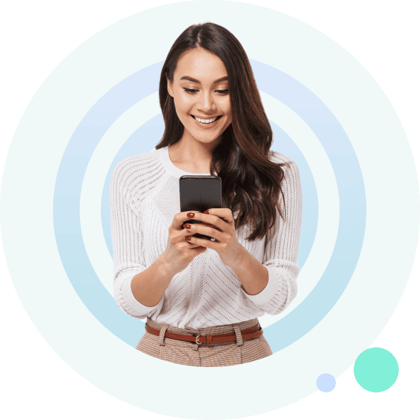 Smiling woman looking at phone